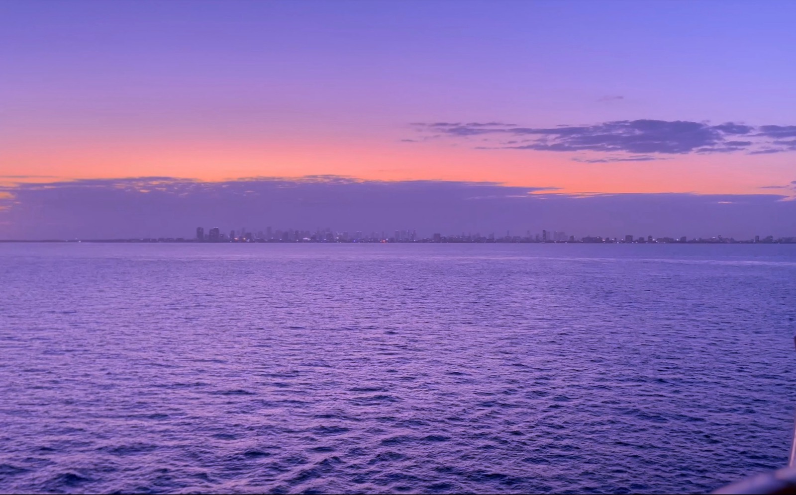 Open water and purple evening sky at sunset